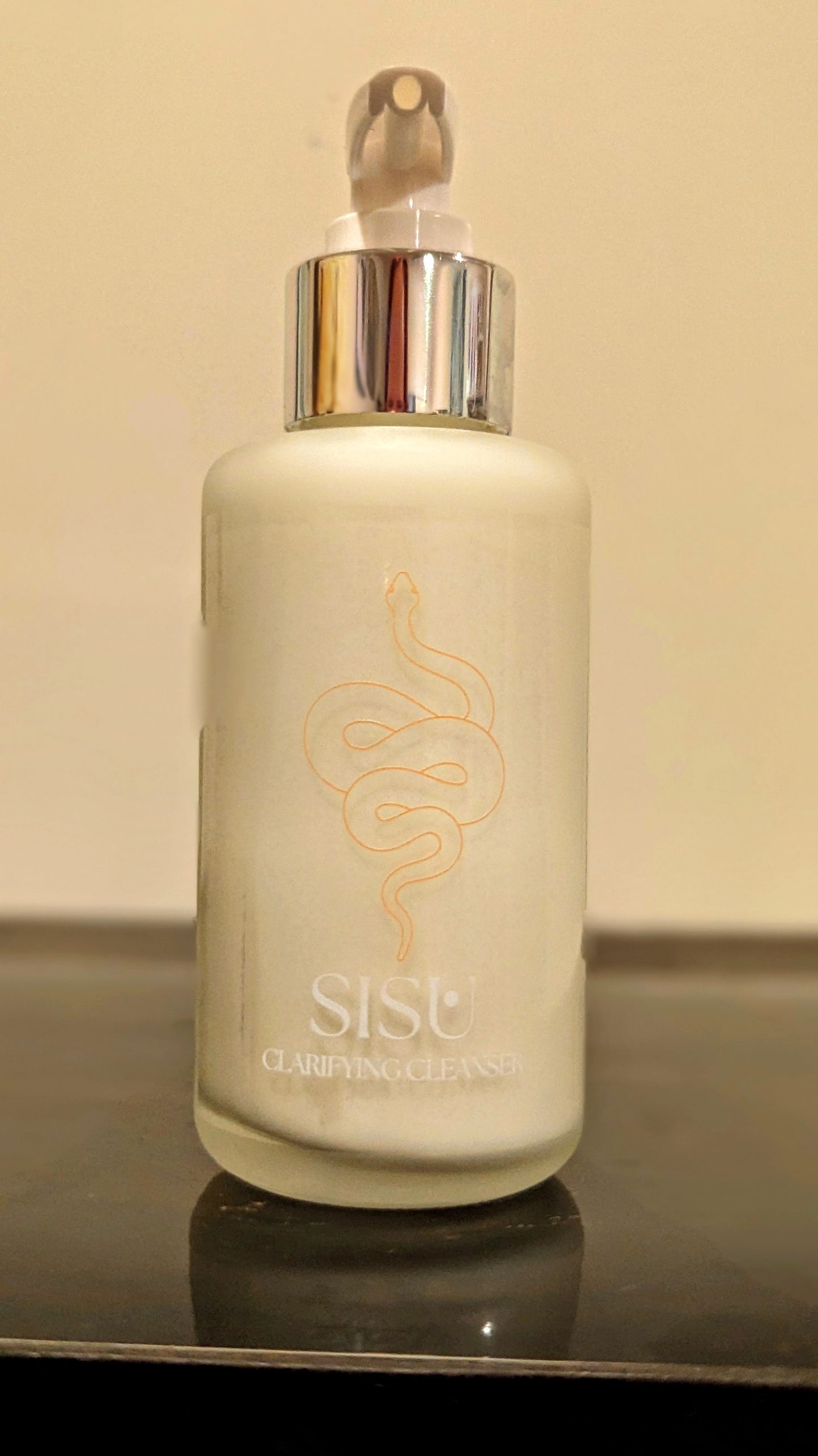 Luxury bottle with gold snake moisturizing cream cleanser for makeup removal and gentle cleansing with oils to nourish skin.  Leaving skin glowing 